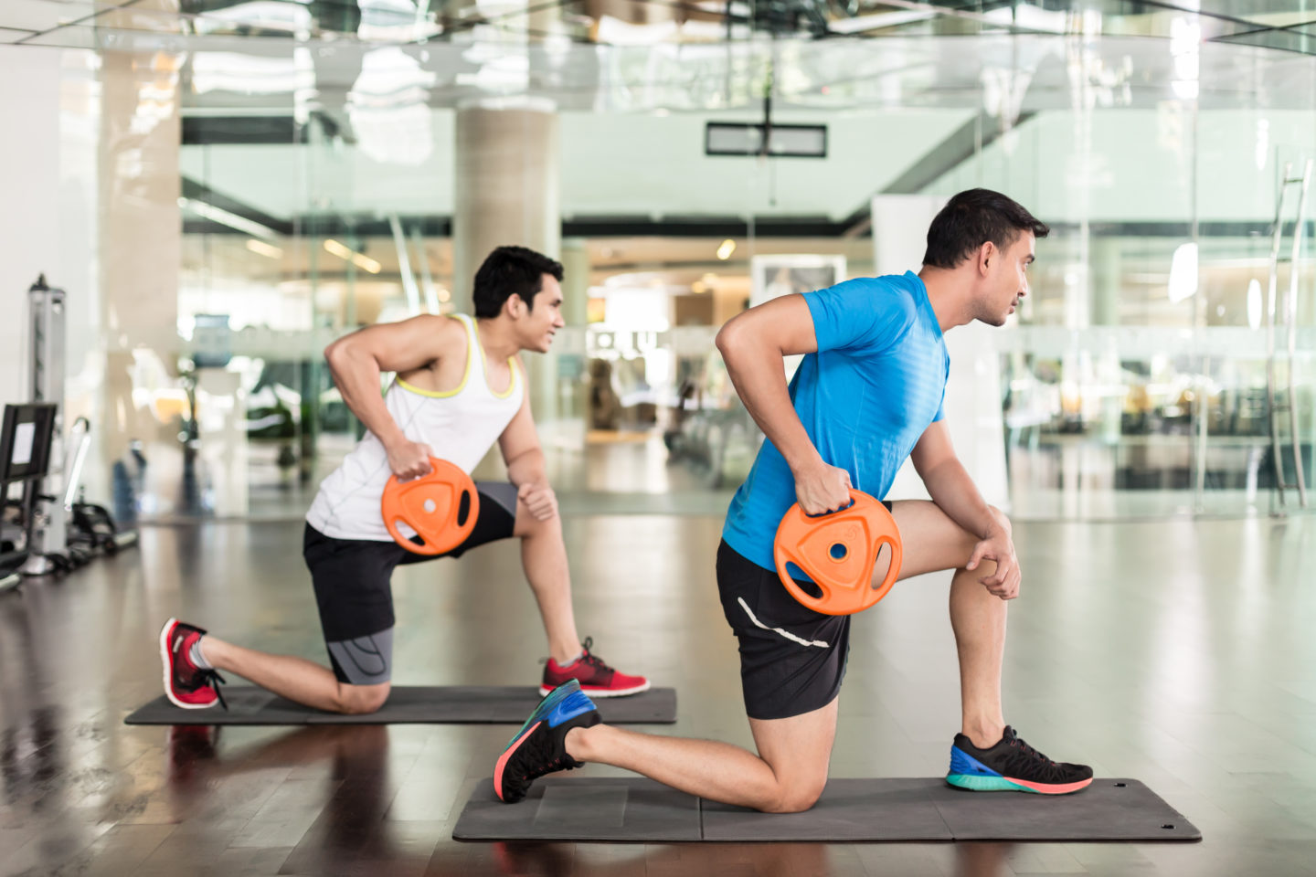 two men strength training in gym two men strength training in gym