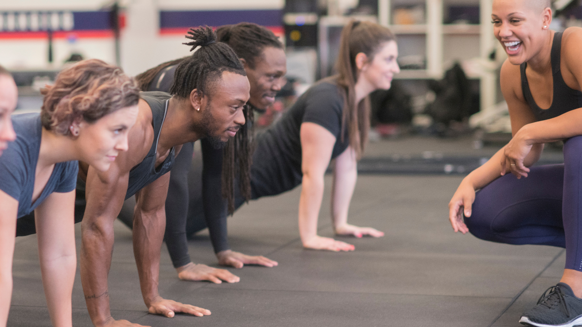 Grp Push Ups smiling trainer